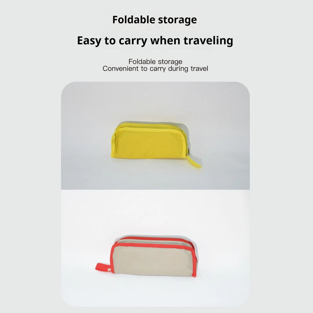 Lightweight foldable camp stool in Oxford cloth, shown in a khaki colour, folded for carrying.