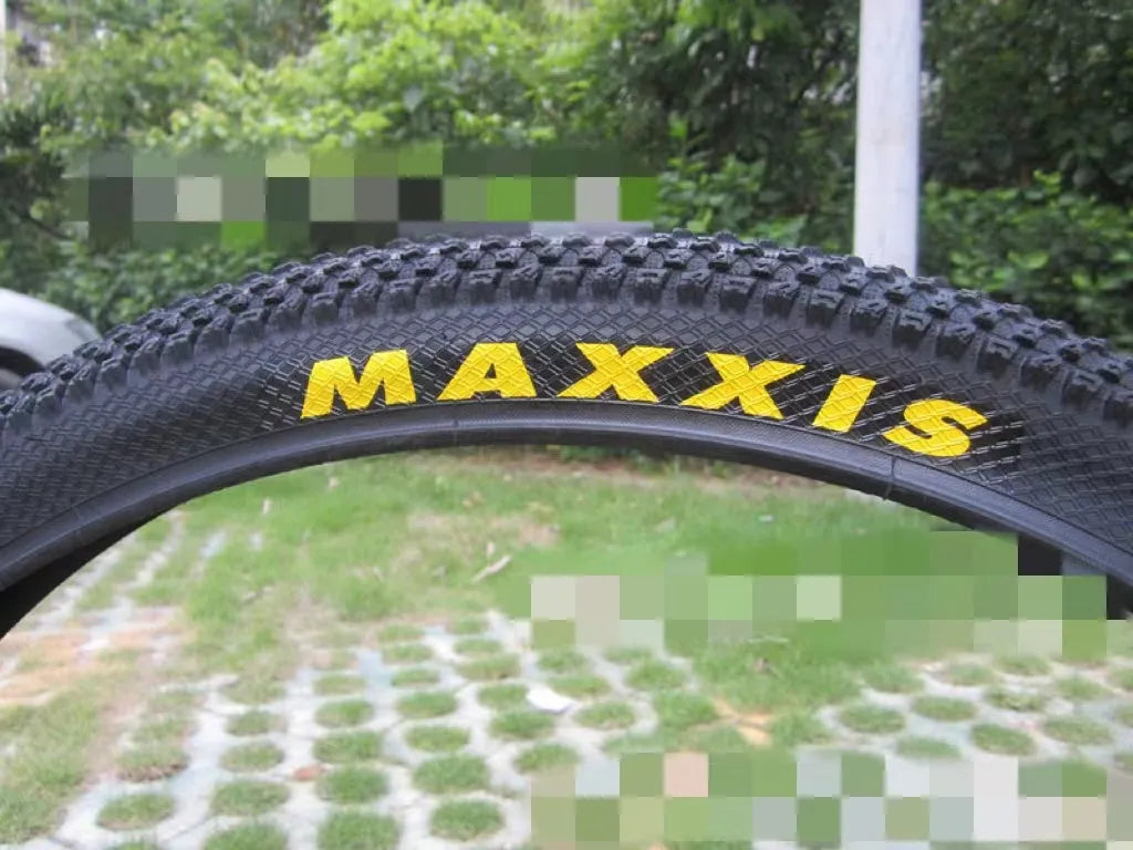 Ultralight puncture-proof mountain bike tyre shown in black with aggressive tread pattern.