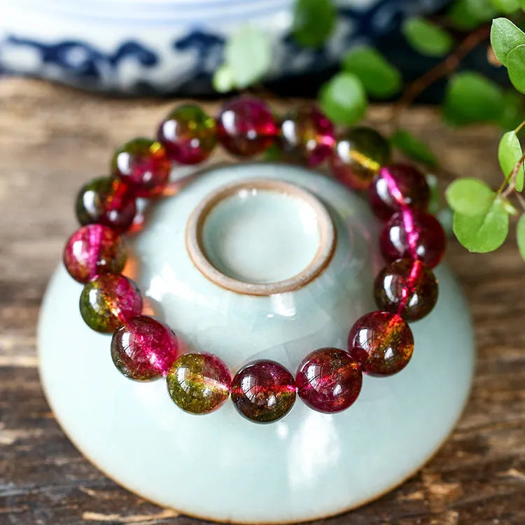 Handmade watermelon crystal bracelet with pastoral design elements on female wrist