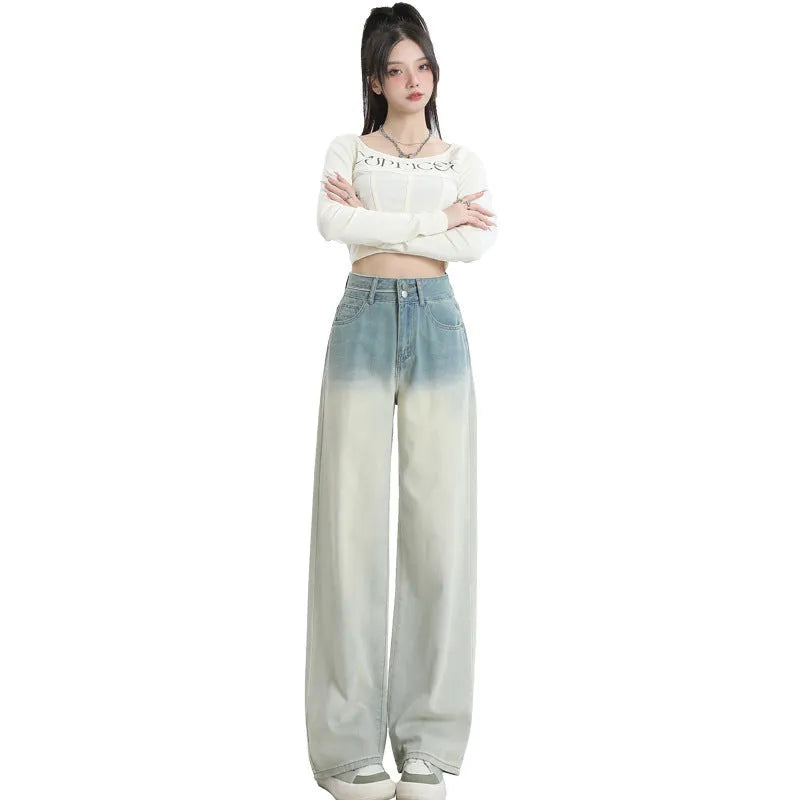 Gradient blue women's straight-leg denim trousers showing colour variation from light to dark blue tones