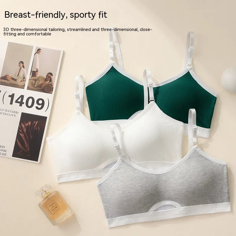 White sports underwear vest with contrast back detail and matching underwear, shown on a hanger.
