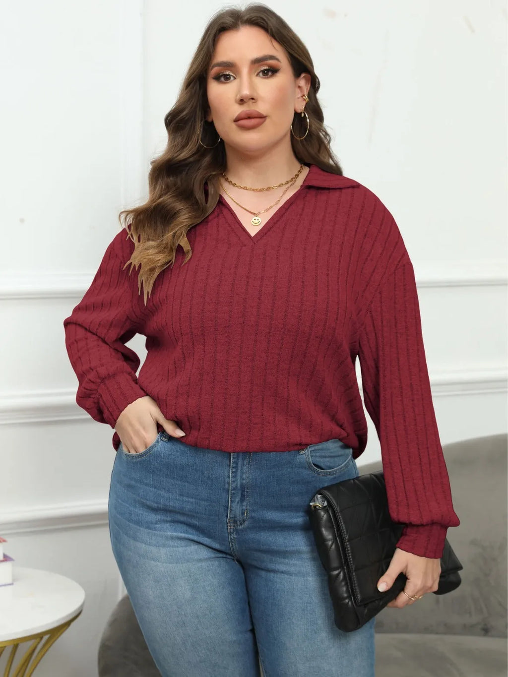 Women's plus size gray fleece pullover with a polo collar and full lantern sleeves.