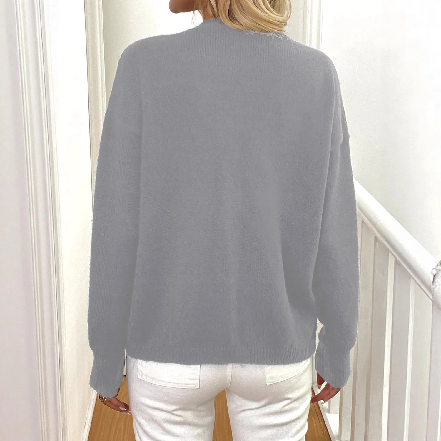 A grey women's long sleeve deer plush sweater coat with princess sleeves in a street hipster style.