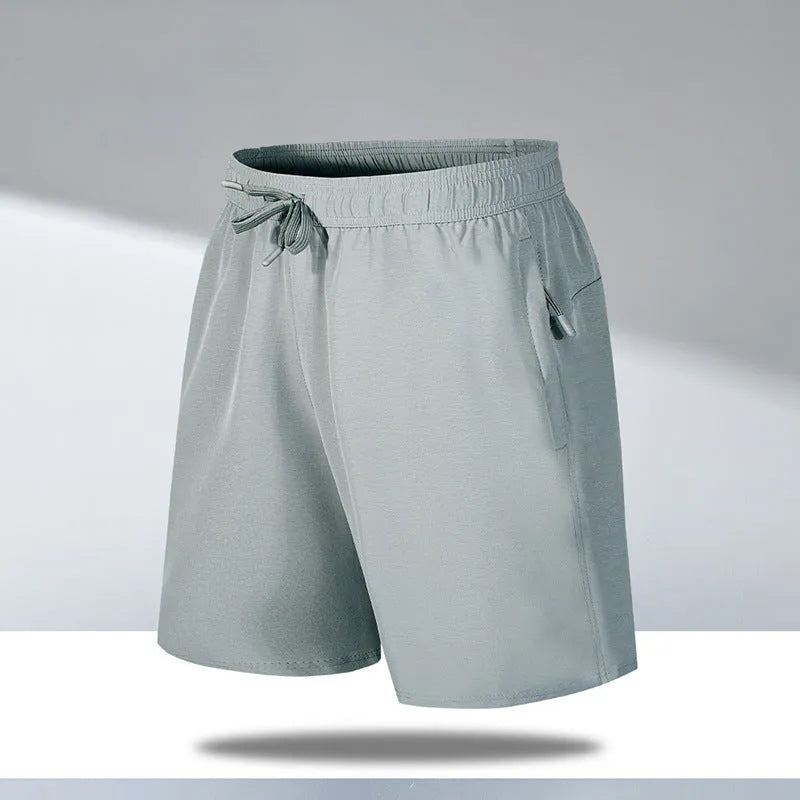 Man wearing loose black quick-dry sports shorts with an elastic waistband
