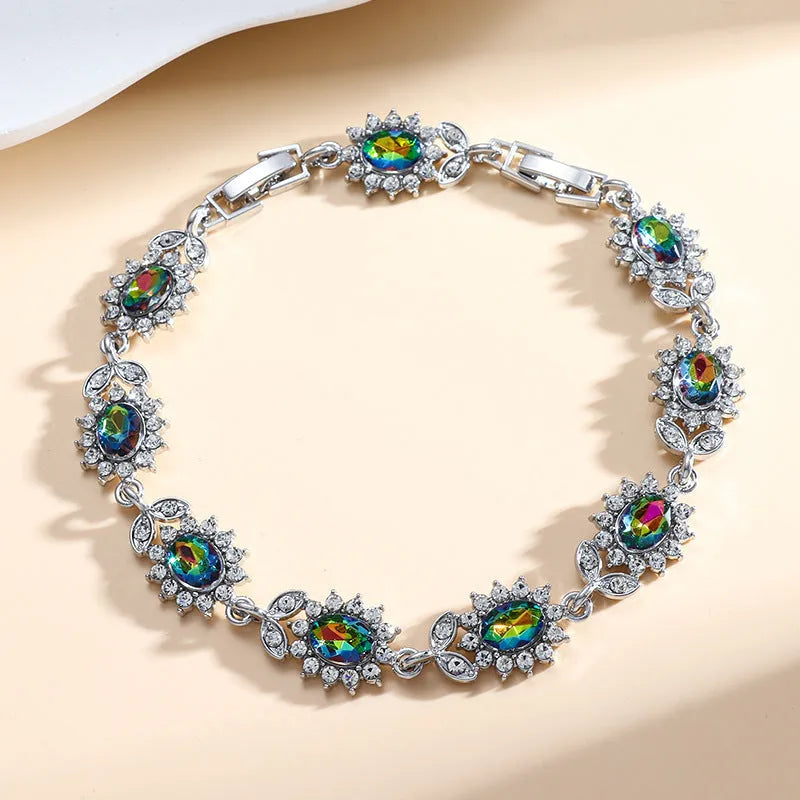 Women's bracelet with inlaid zircon gemstones in multiple colours on environmentally friendly alloy band