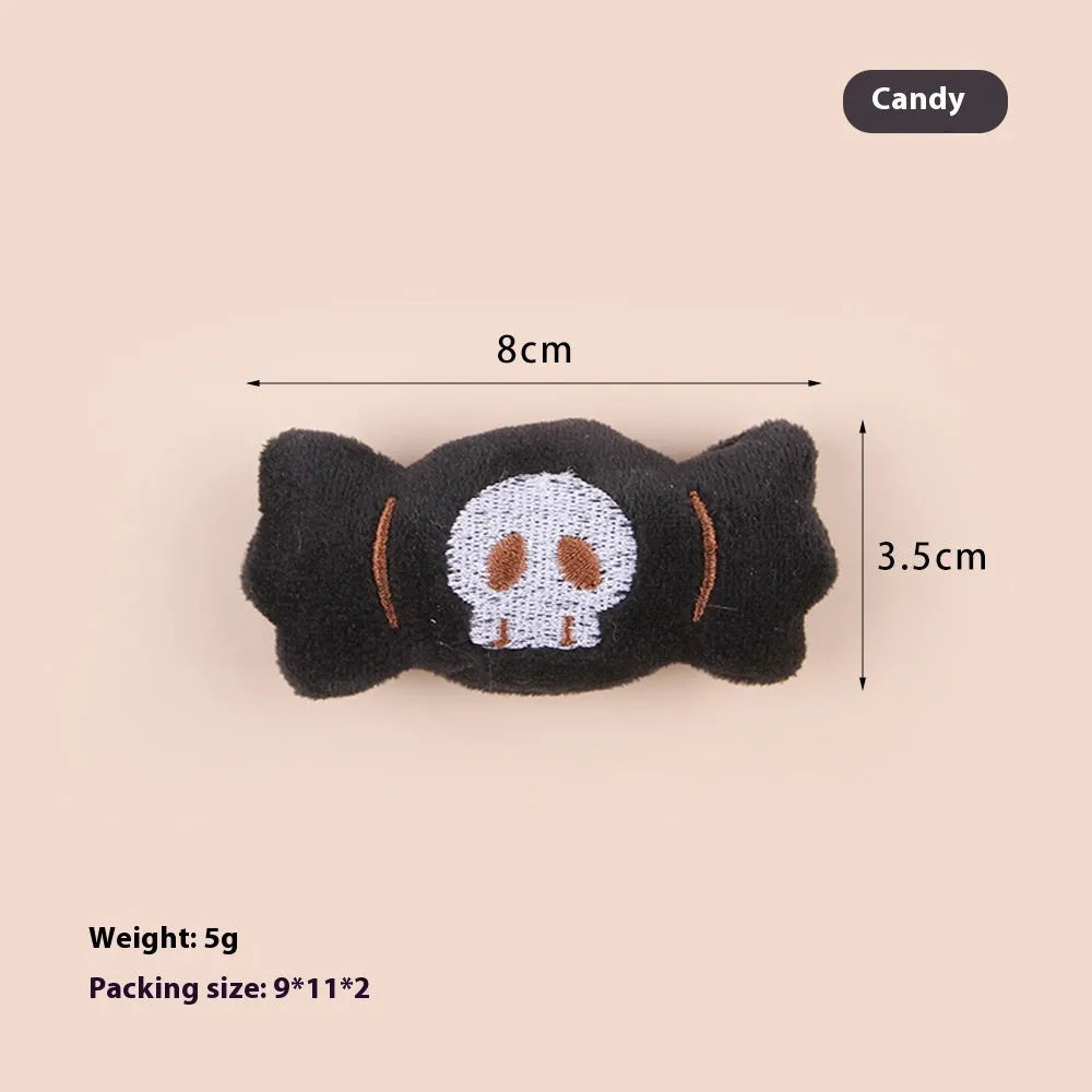 Small plush cat teaser toy with candy and skull designs in eyes or candy colours