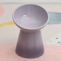 Black ceramic pet bowl with a raised foot and high neck guard for dogs and cats.