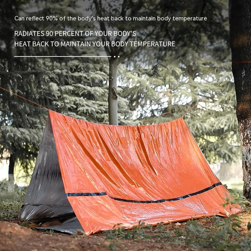 Orange emergency survival tent with sleeping bag and blanket for disaster relief