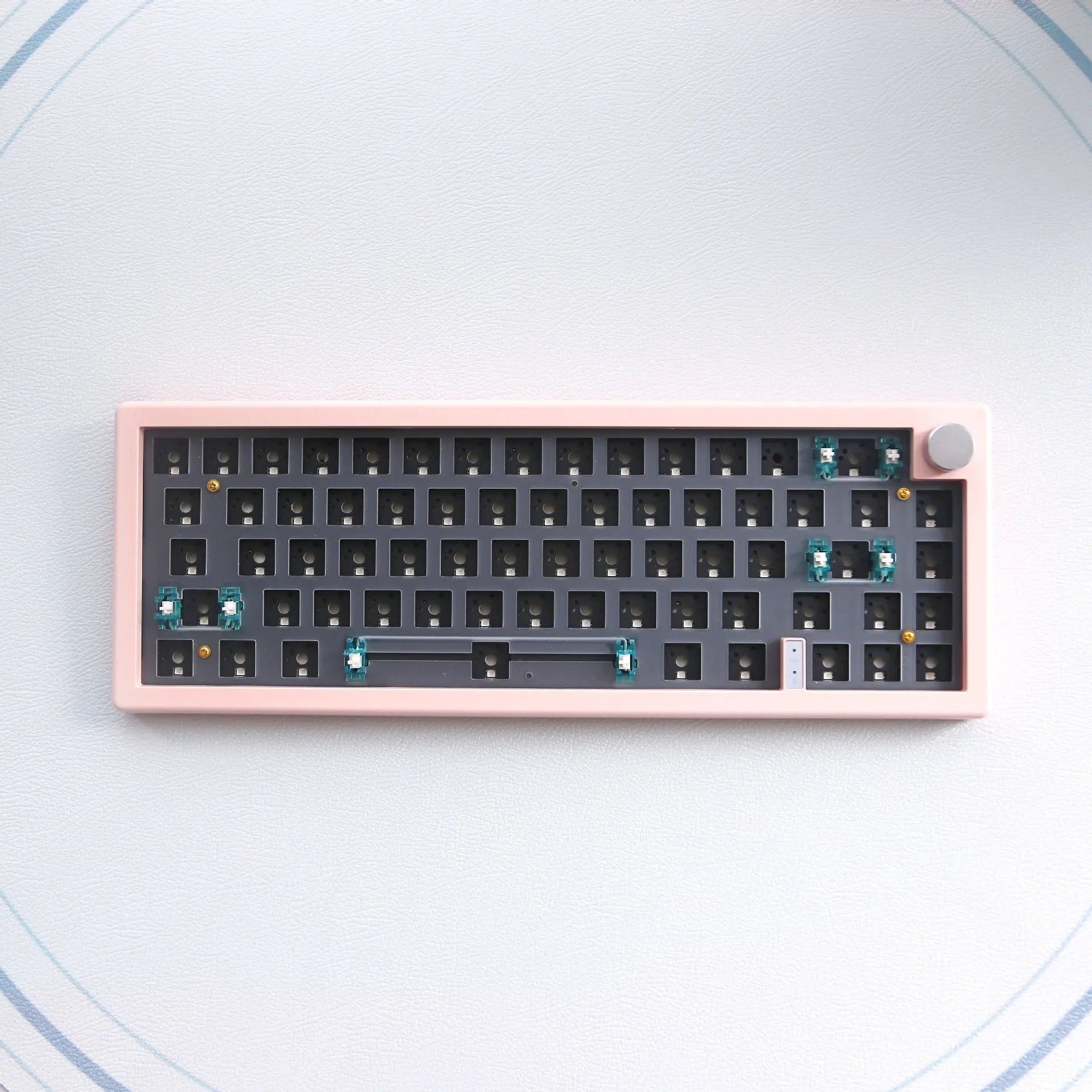 DIY mechanical keyboard kit with RGB lighting and control knob in seven colour options