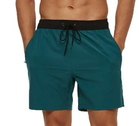 Men's blue drawstring shorts with a zippered pocket and stitching waist detail
