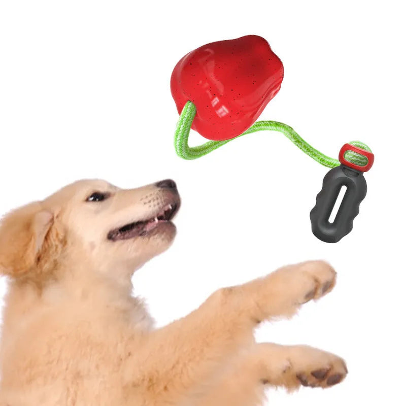 Green plastic dog food dropping ball molar toy with apple design for interactive feeding and chewing