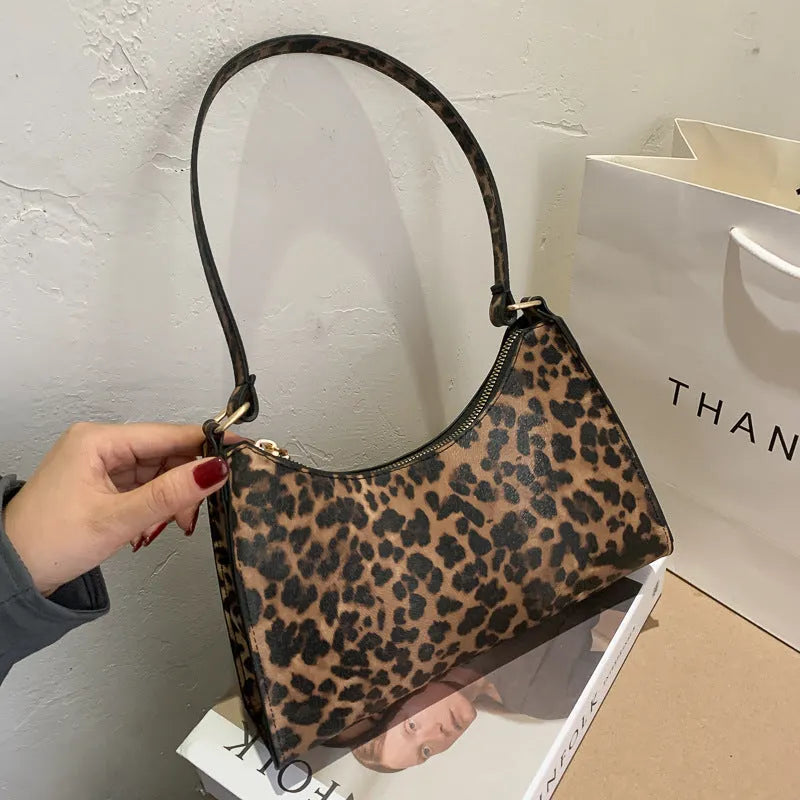 Women's small square underarm bag in PU leather, shown in multiple colour options including leopard print.