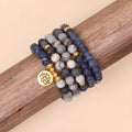 Blue patterned network stone beads on a multi layer alloy chain bracelet