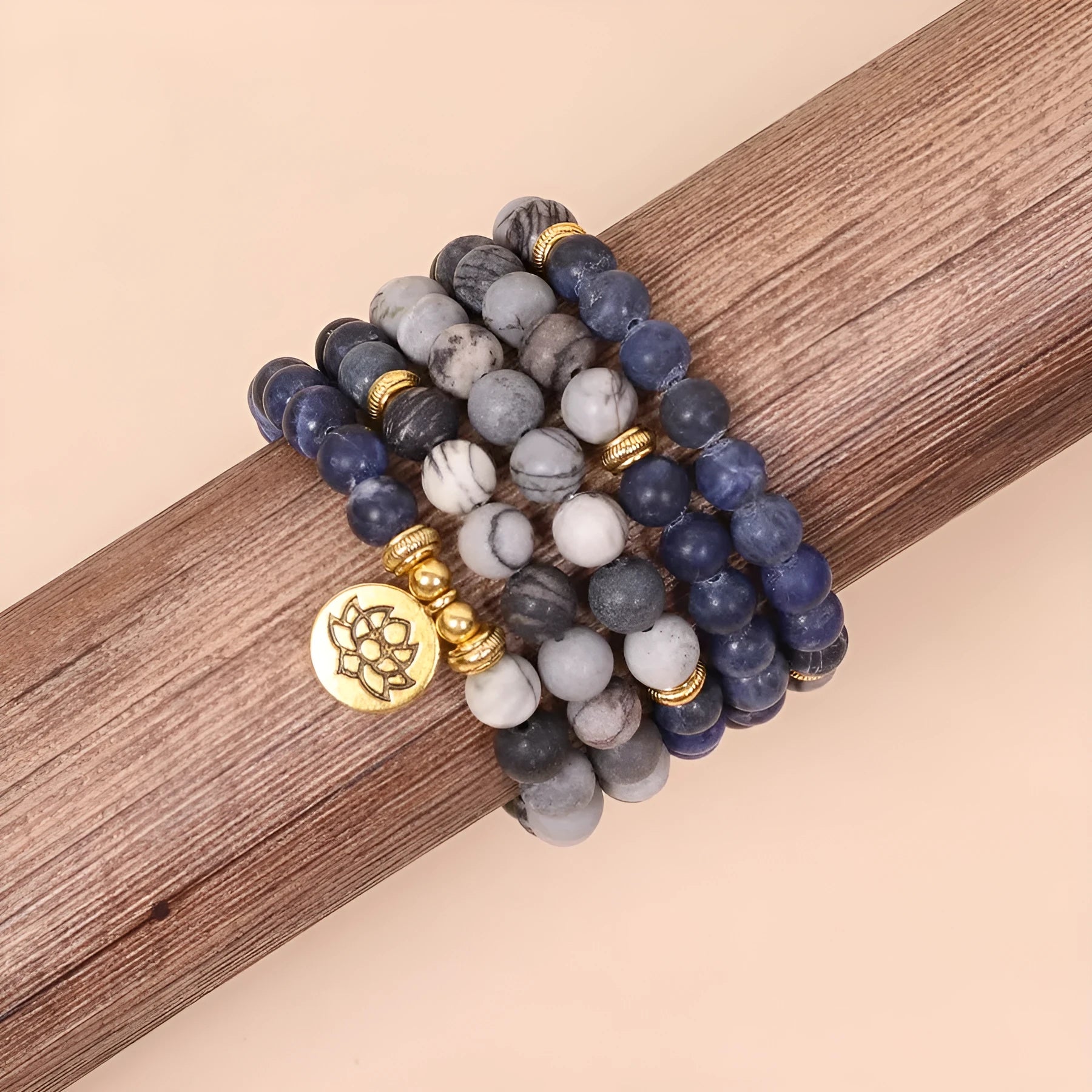 Blue patterned network stone beads on a multi layer alloy chain bracelet