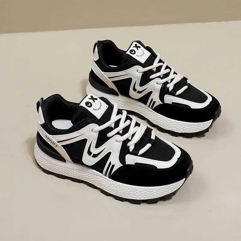 Women's black lace-up platform casual sports shoes with round toe and flat heel.