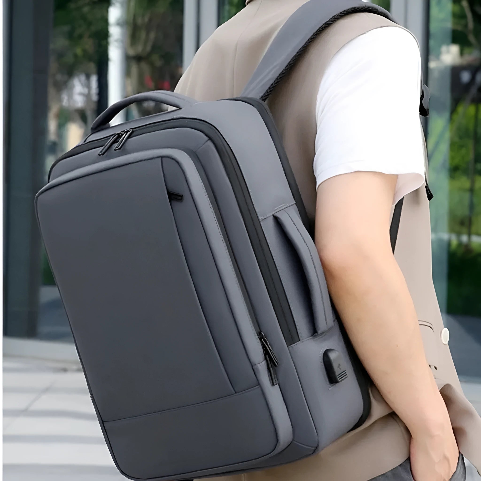 Large black business backpack with curved shoulder strap and waterproof Oxford cloth construction
