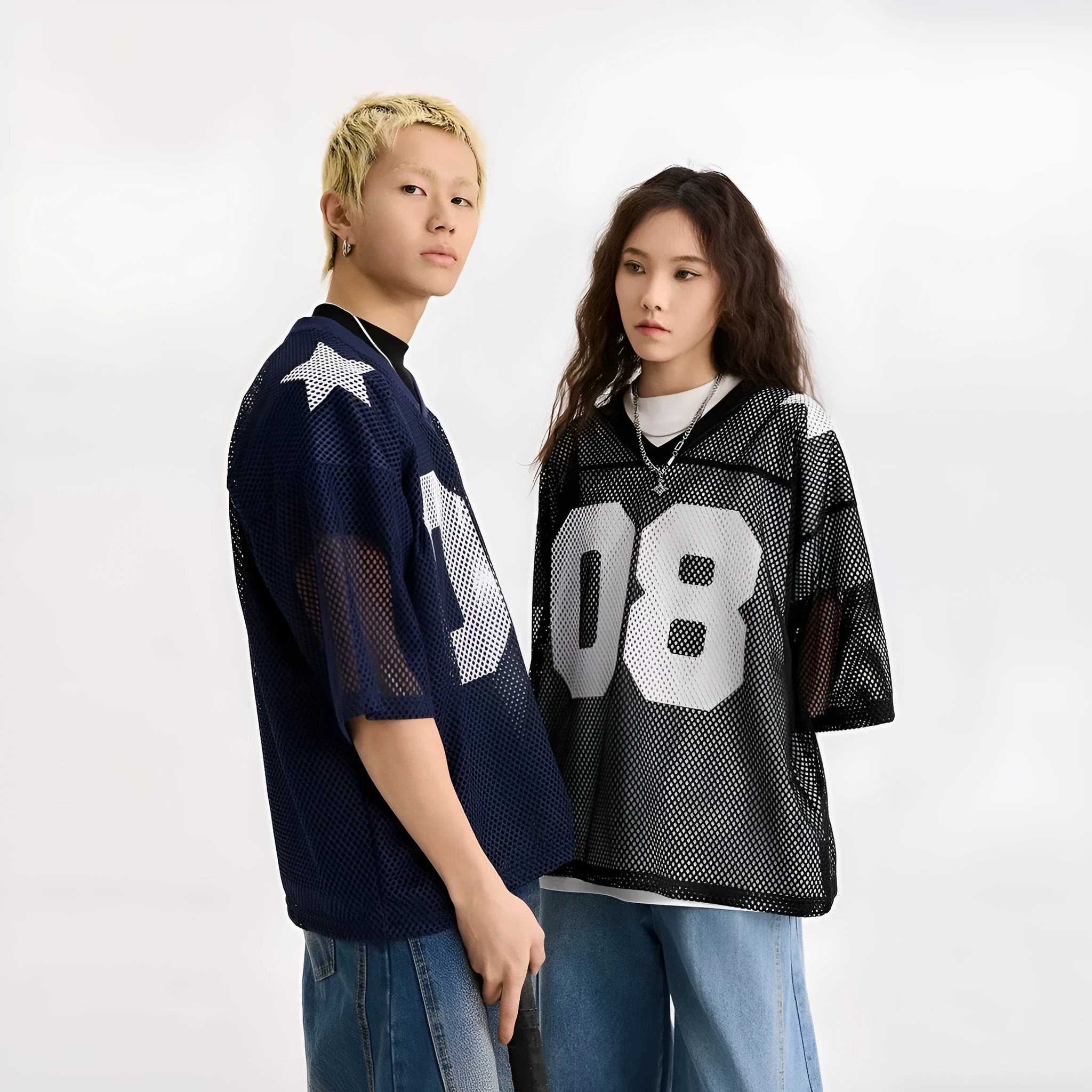 Black loose fit pullover shirt with a white letter pattern across the chest, modelled on a mannequin.