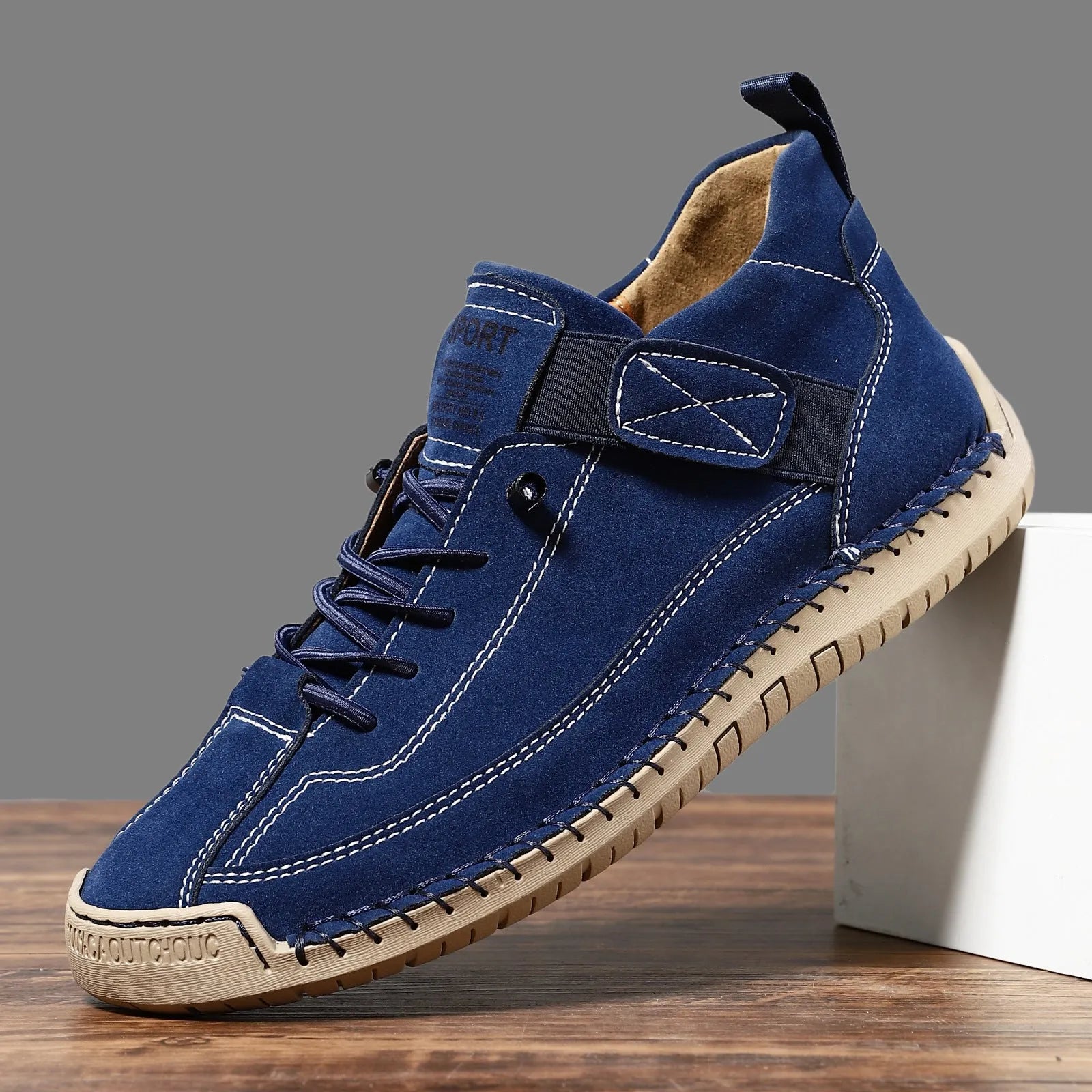Men's mid-top Martin boot in khaki colour with tooling stitching on the rubber sole.