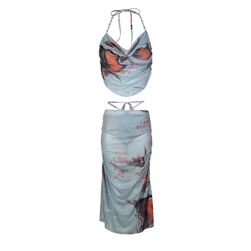 Blue women's three-piece bikini set with diamond chain detail on backless briefs