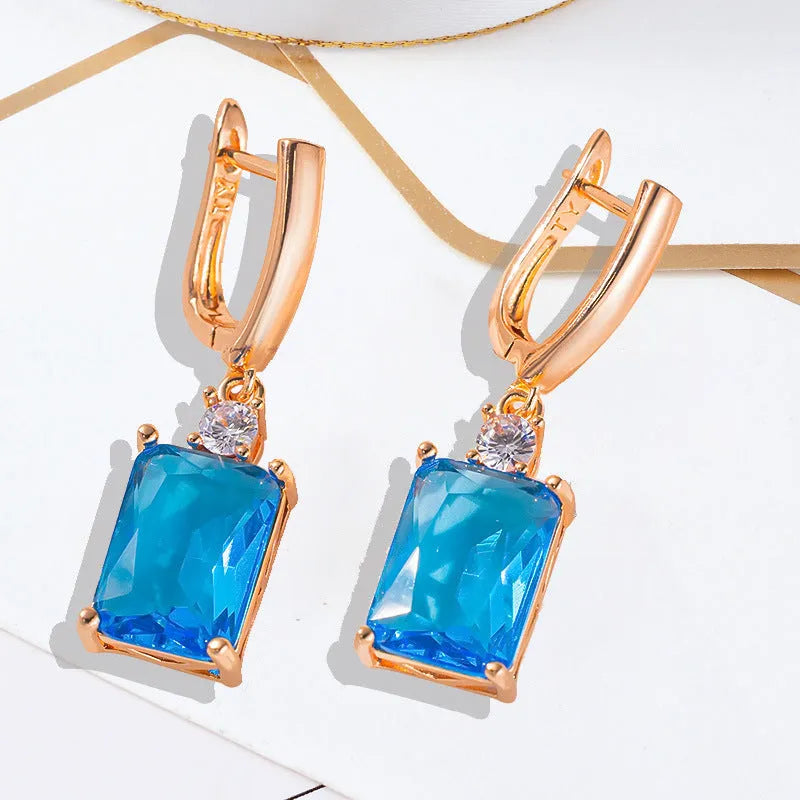 Square geometric copper earrings with gold electroplated finish showing quadrilateral shape