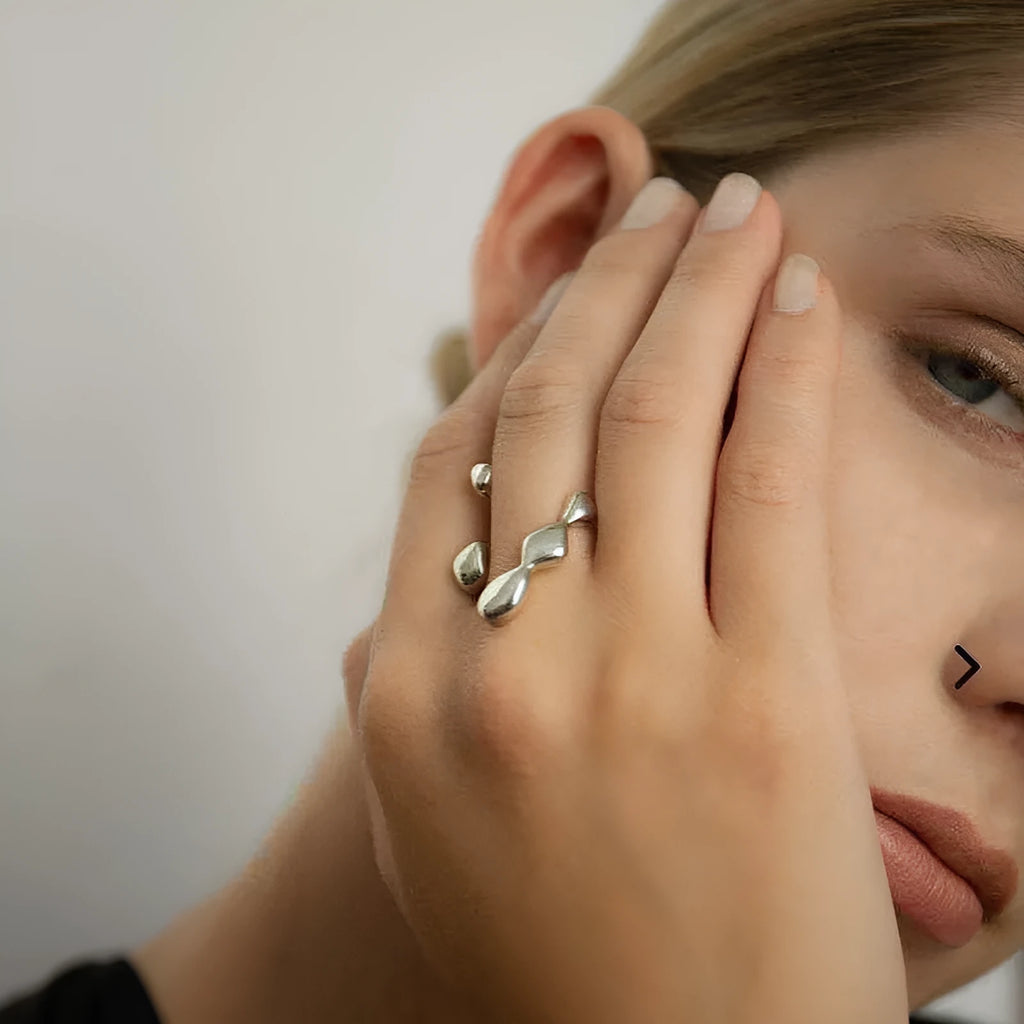 Women's brass opening ring with gold finish and circle sphere design