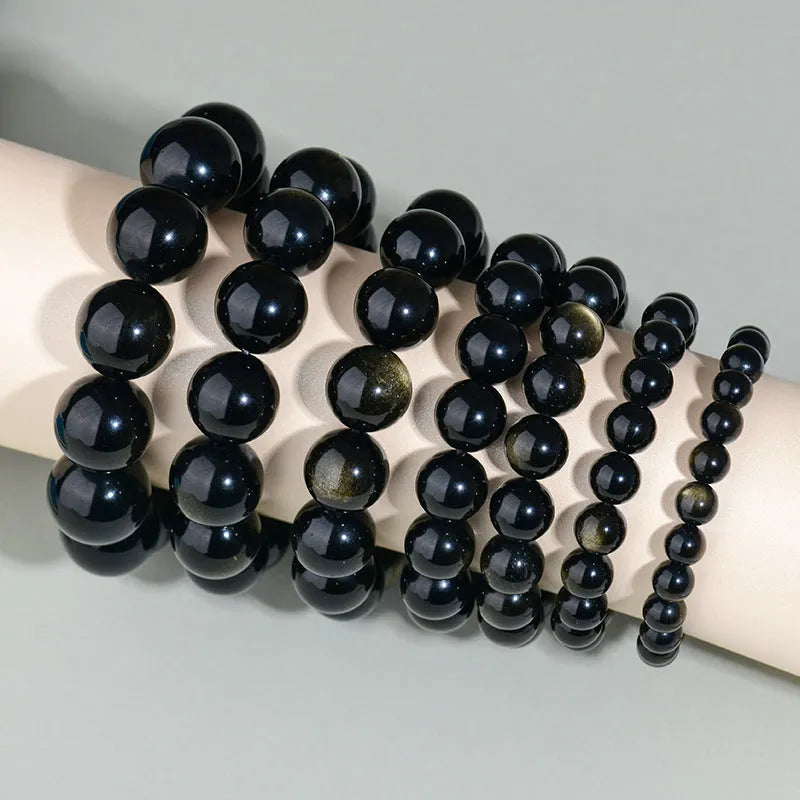 Hand-woven obsidian bracelet with round crystal beads in multiple colour options