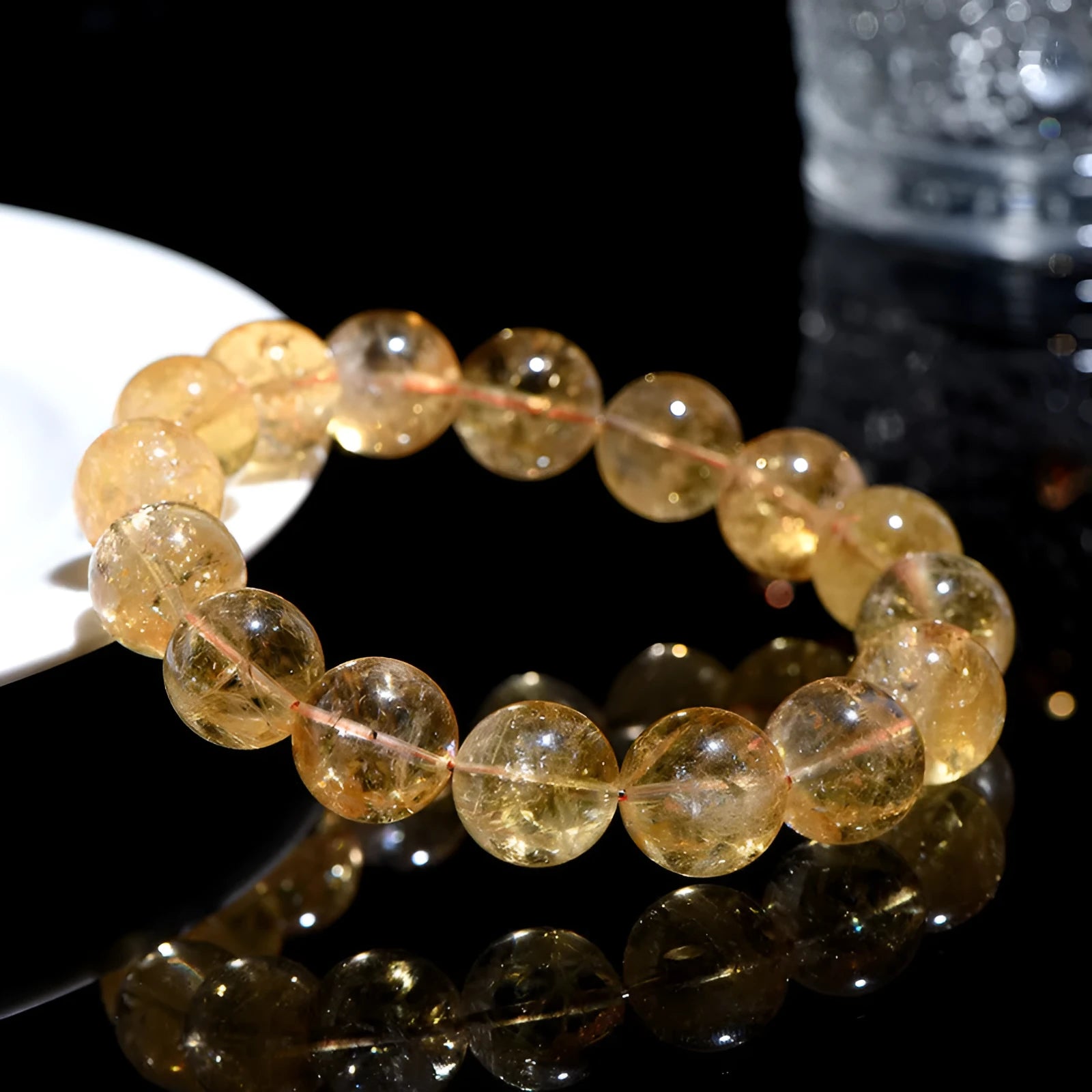 Natural yellow citrine gemstone bead bracelet showing geometrical beads on a string.