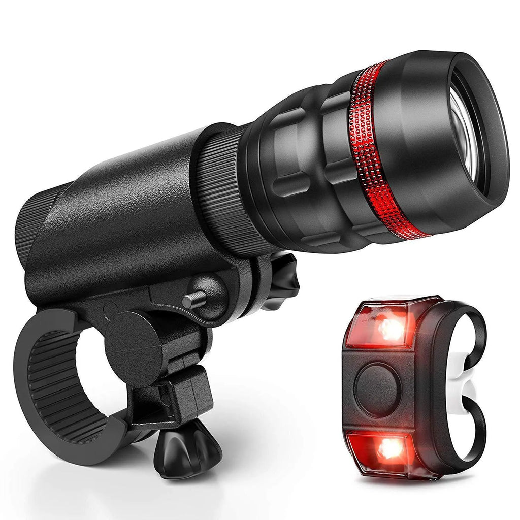 Bicycle headlight and red taillight set with mounting brackets on a bike.