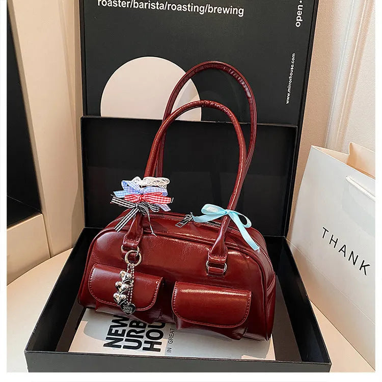 Retro women's pillow bag in PU leather with double shoulder straps and flap closure