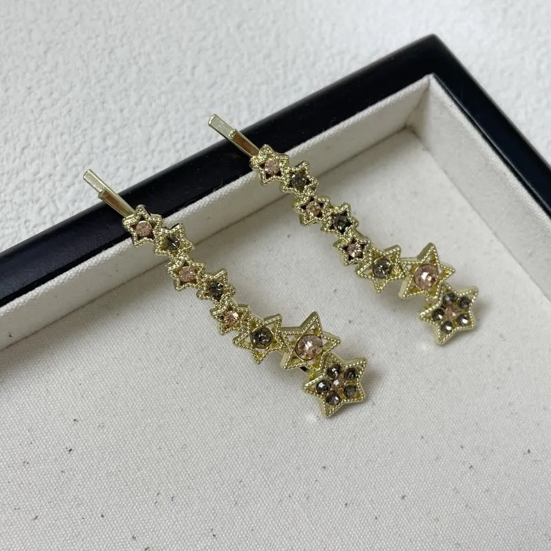 Gold rhinestone barrette with star design for clipping bangs and side hair