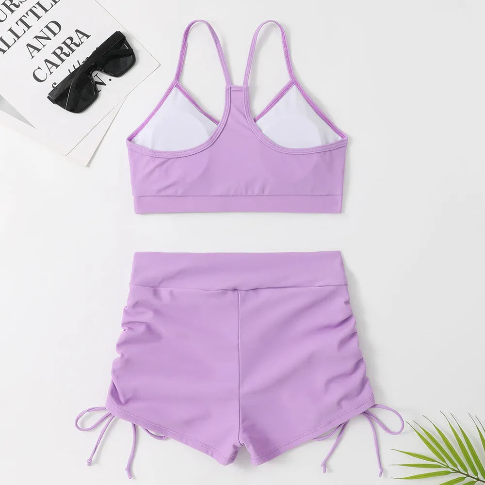 Women's purple high waist split swimsuit with bikini top and shorts
