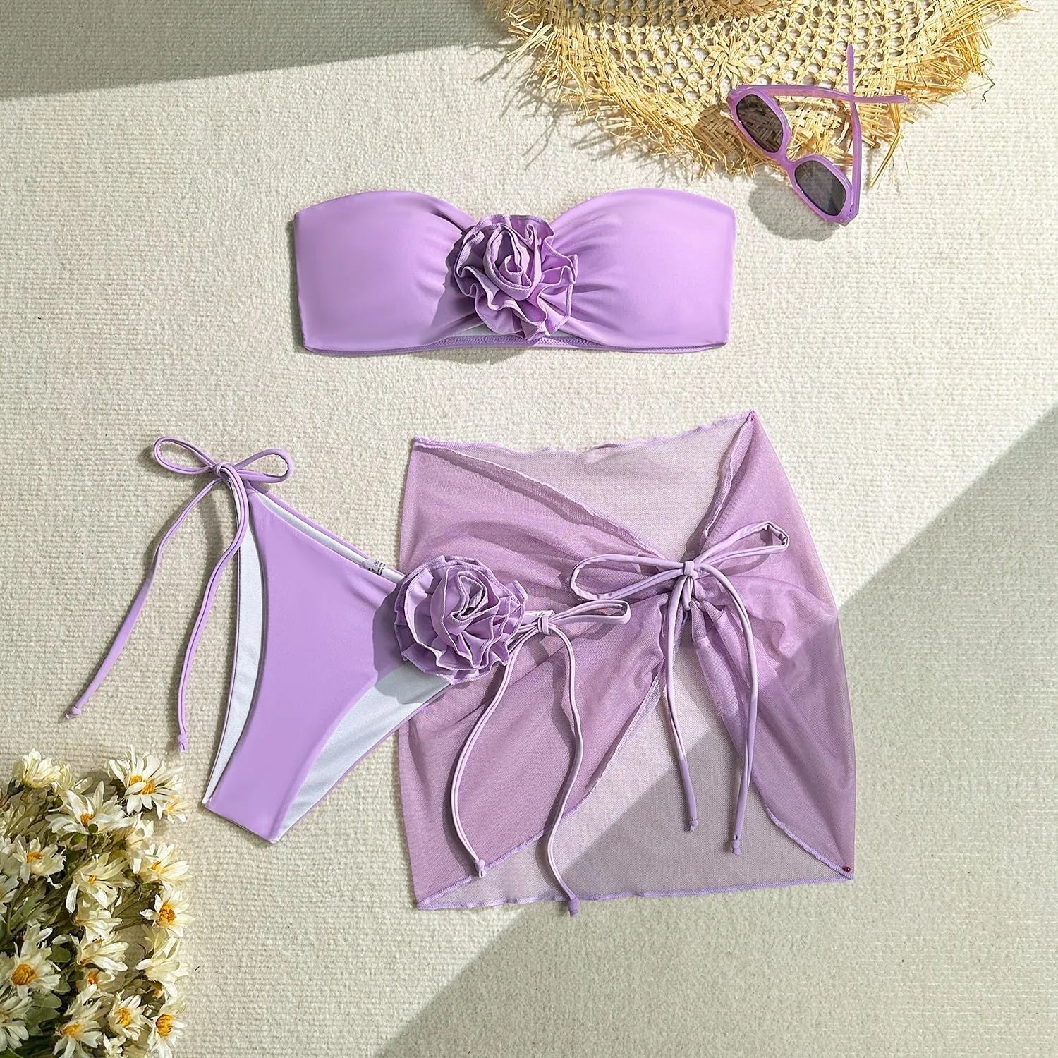 Women's pink swimsuit set with floral tube top, pants, and skirt for swimming.