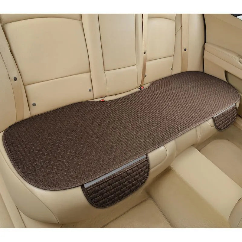 Linen car seat cushion in charm coffee colour showing hemmed edge detail
