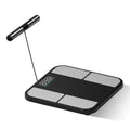 Black electronic weighing scale with a large tempered glass platform and colour touchscreen display.