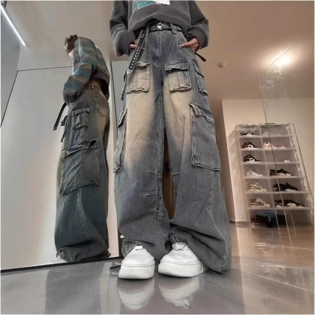 Loose fit denim pants with multiple pockets in washed distressed light blue finish