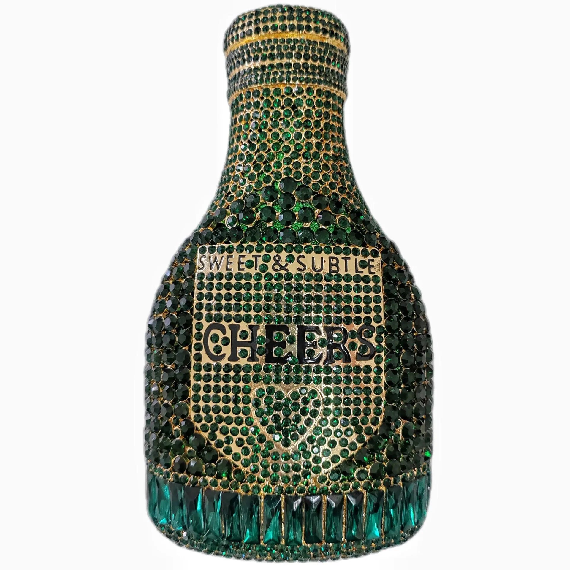 Gold hard-shell champagne bottle shaped evening clutch with rhinestones on a table.