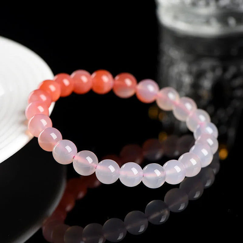 Natural gradient Yanyuan agate stone bracelet showing geometric beads in salt source colour, with size options.