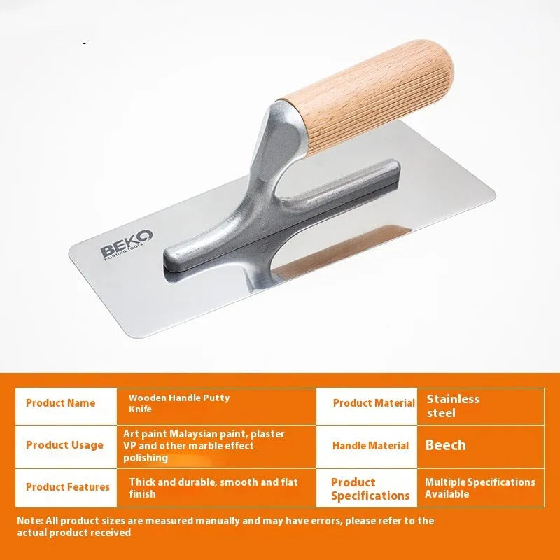 Three stainless steel putty scraper tools with wooden handles in different sizes on a workbench.