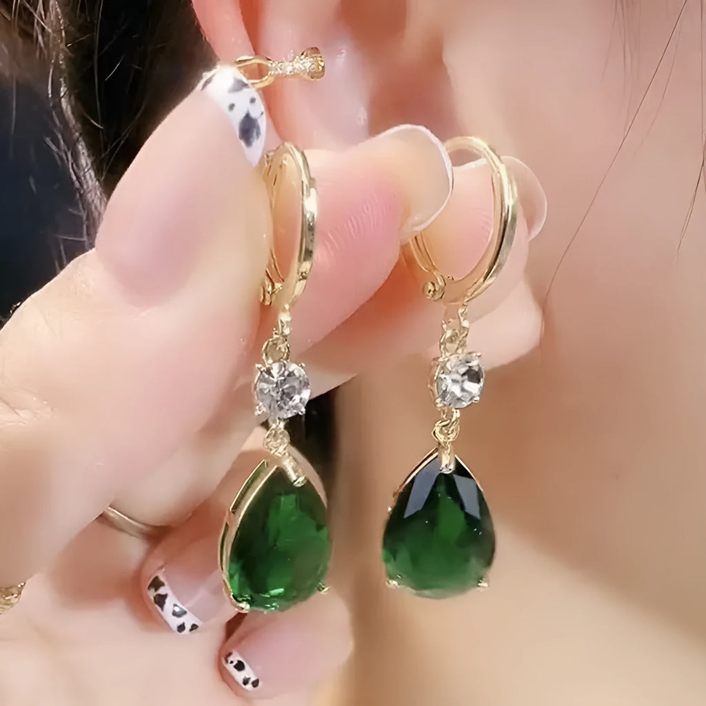 Green geometric teardrop earrings with alloy construction showing structured patterning