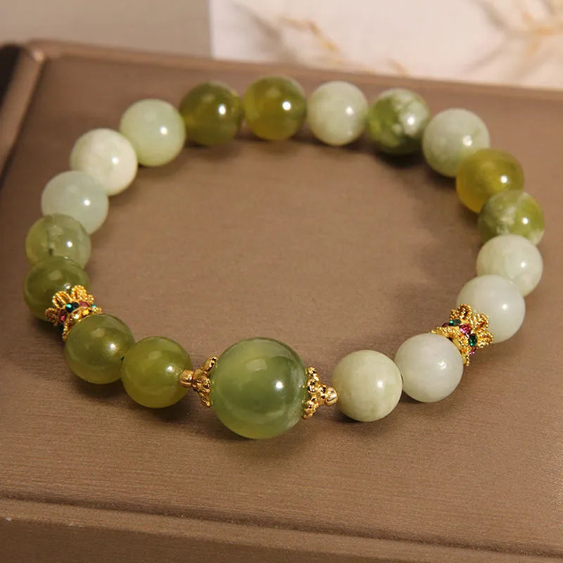 Women's bracelet made of green Xiuyan jade in a light luxury sweet Mori style design.