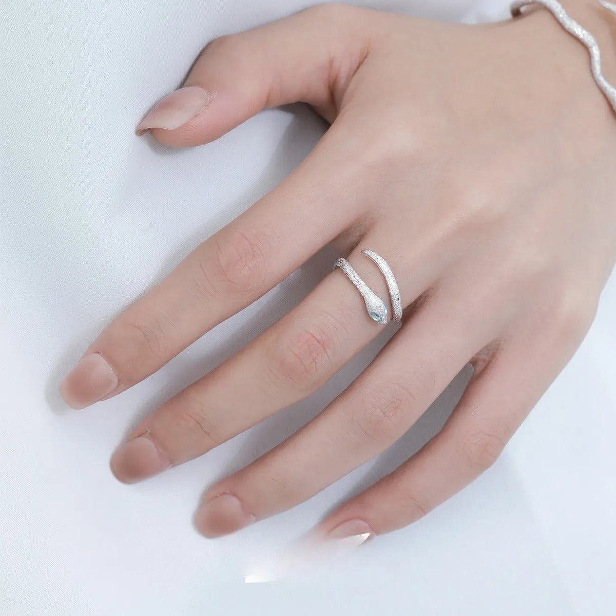 Silver snake design ring with adjustable opening and platinum colour electroplated finish