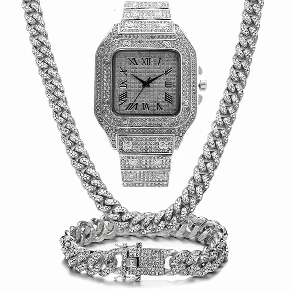 Gold Roman numeral square dial watch with diamond studs and mesh band, part of a three-piece jewellery set.