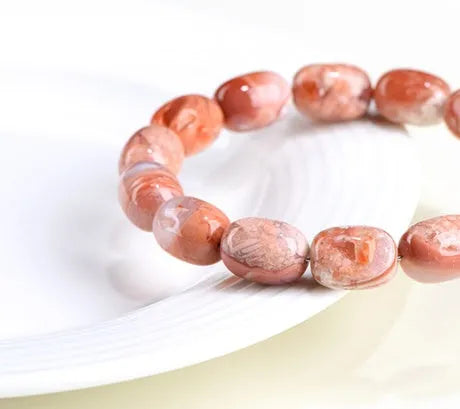 Natural cherry agate barrel bead bracelet with geometric 10x14mm beads and Ruyi charm