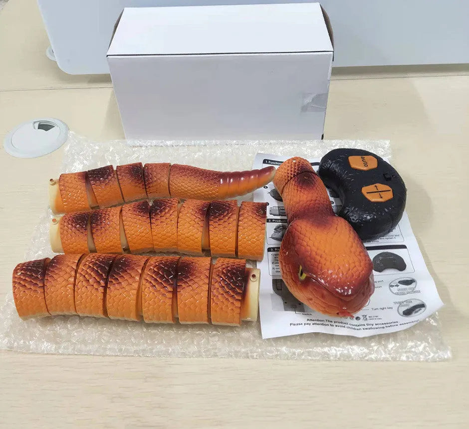 Smart sensing electronic snake cat toy with segmented plastic body and USB charging cable.