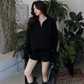 Women's knitted suit with cable knit sweater and elastic waist shorts in creamy-white colour