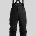 Man wearing black waterproof ski trousers with an adjustable strap on a snowy slope.