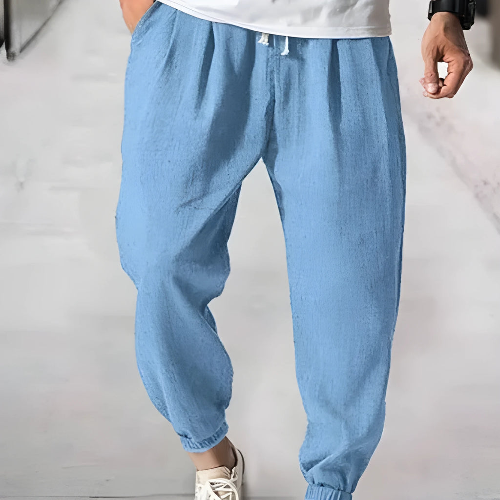 Men's loose-fit cotton trousers with elastic ankle cuffs in multiple colour options