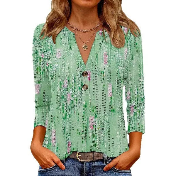 Woman wearing a loose V-neck T-shirt with a bold 3D pattern print in casual style.