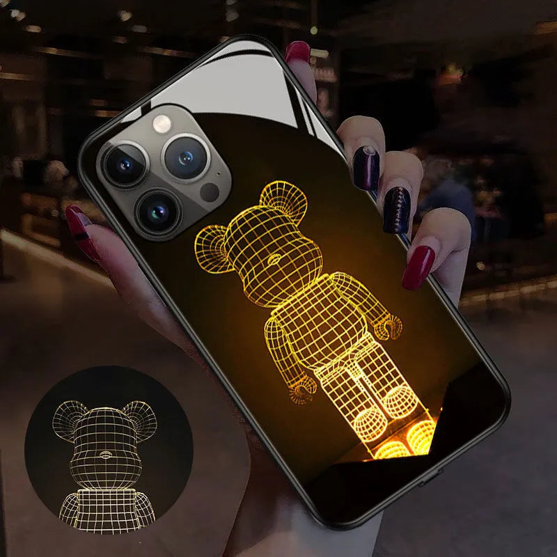Smart luminous TPU and tempered glass protective case for iPhone models, showing one of the graphic design variants.