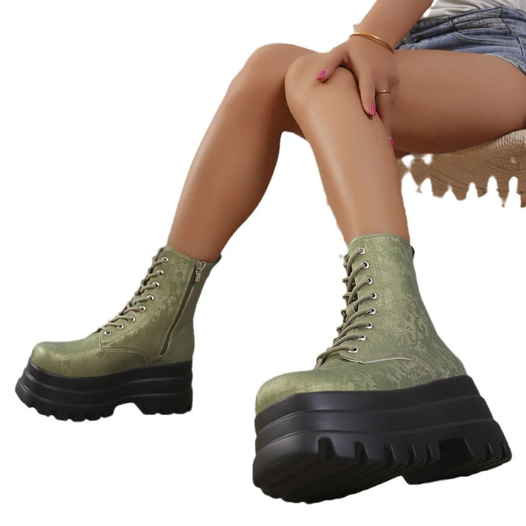 Women's black retro platform boots with patchwork round toe and side zip.